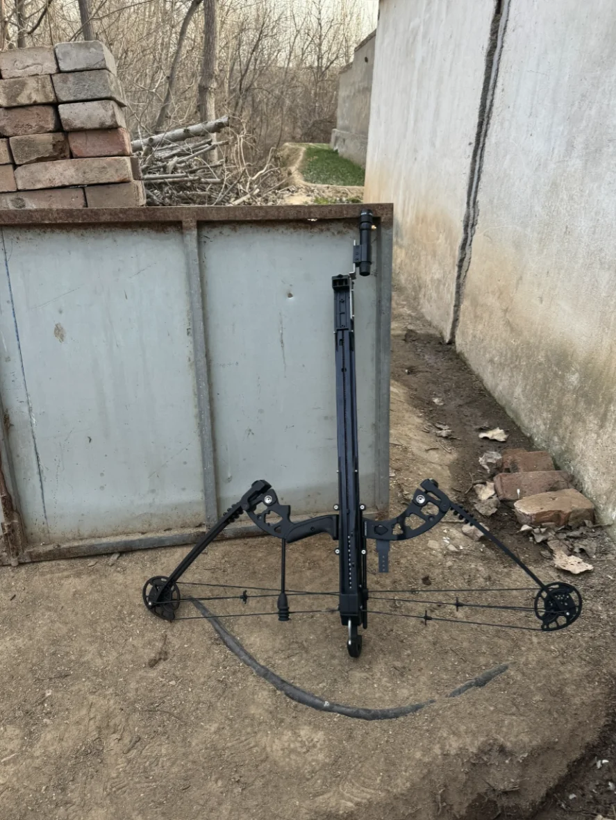 A full view of the bow, photographed outside beside a garden gate.