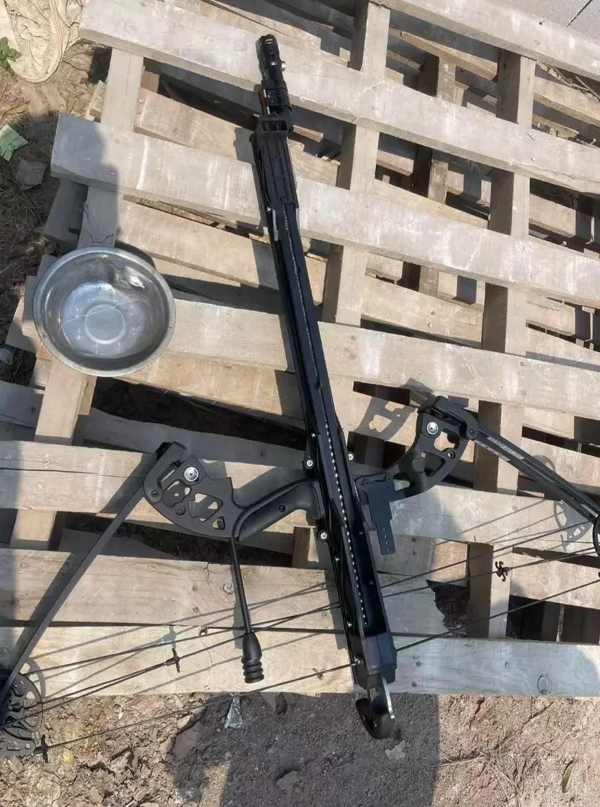 The rail, grip and cables captured from above on a wooden pallet.
